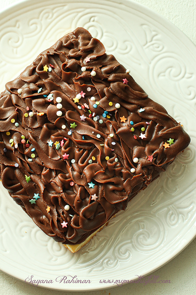Image of frosted buttermilk sheet cake with sprinkles